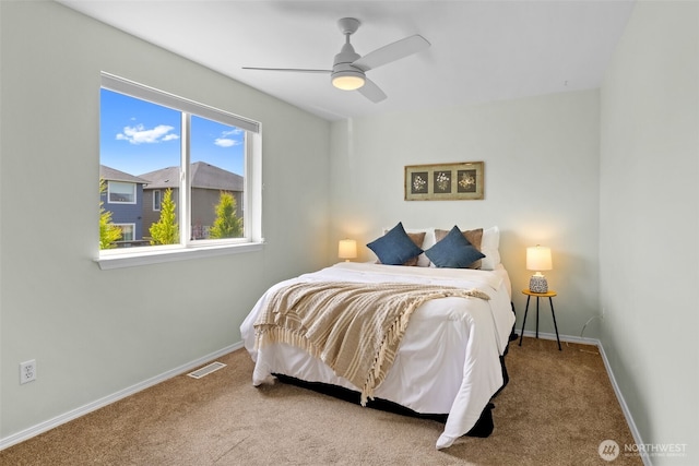 10873 SE 214th Pl, Kent, WA 98031 - carpeted bedroom with baseboards and a ceiling fan