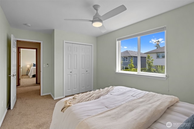 10873 SE 214th Pl, Kent, WA 98031 - bedroom featuring light carpet, a closet, and ceiling fan