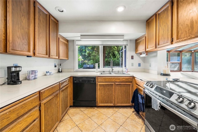 8113 S 121st St, Seattle, WA 98178 - kitchen with black dishwasher, stainless steel electric range, brown cabinets, and recessed lighting