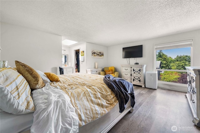 8113 S 121st St, Seattle, WA 98178 - bedroom featuring wood finished floors and a textured ceiling