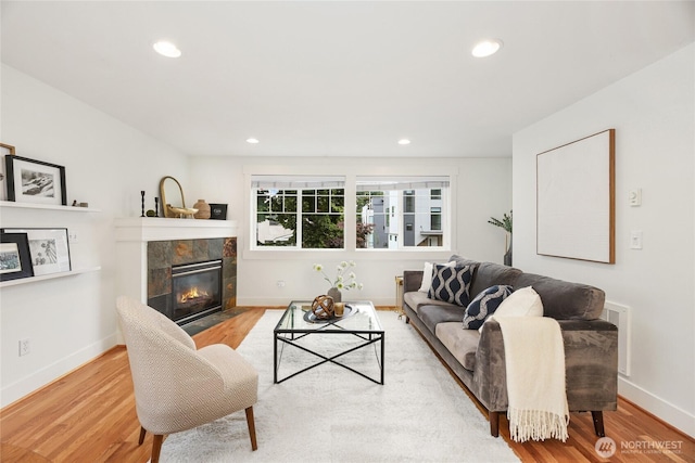 9217 Roosevelt Way NE Unit B, Seattle, WA 98115 - living room with wood finished floors, recessed lighting, and a tiled fireplace