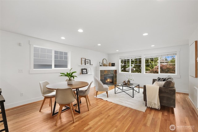 9217 Roosevelt Way NE Unit B, Seattle, WA 98115 - dining space with light wood-style floors, a tiled fireplace, and recessed lighting