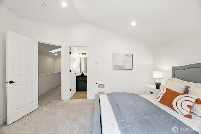 9217 Roosevelt Way NE Unit B, Seattle, WA 98115 - bedroom featuring lofted ceiling, light colored carpet, recessed lighting, and ensuite bathroom