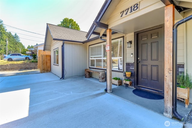 7718 50th Ave E, Tacoma, WA 98443 - doorway to property featuring a shingled roof