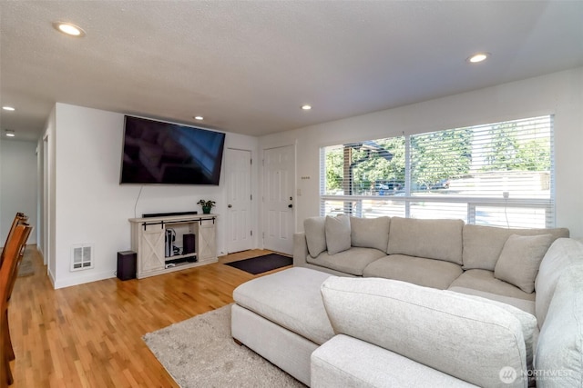 7718 50th Ave E, Tacoma, WA 98443 - living area featuring light wood-style floors and recessed lighting