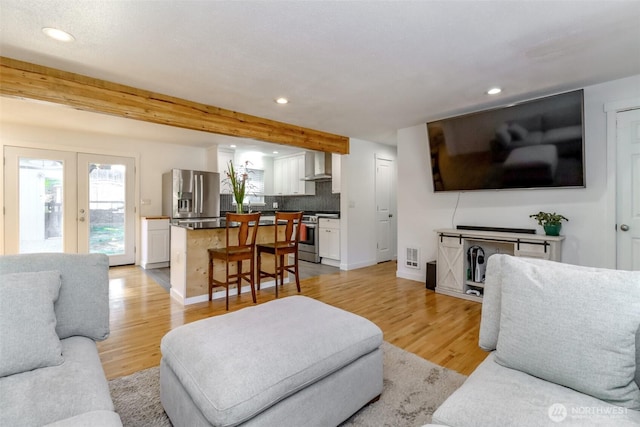 7718 50th Ave E, Tacoma, WA 98443 - living area with recessed lighting, light wood-style flooring, french doors, and beamed ceiling