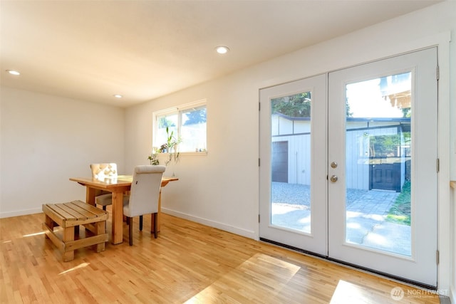 7718 50th Ave E, Tacoma, WA 98443 - dining space featuring french doors, light wood finished floors, and recessed lighting