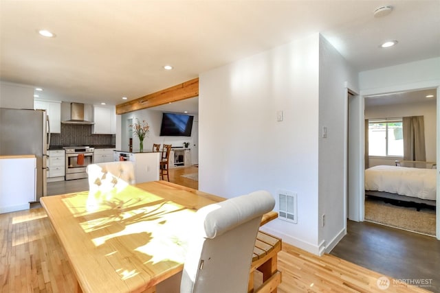7718 50th Ave E, Tacoma, WA 98443 - dining room with light wood-style floors and recessed lighting