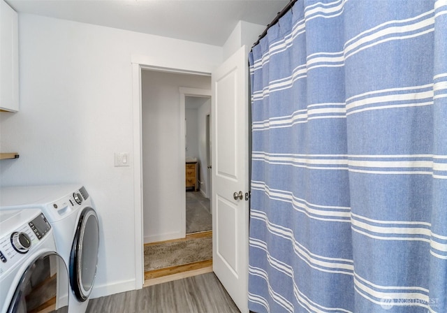 7718 50th Ave E, Tacoma, WA 98443 - laundry room with independent washer and dryer and wood finished floors