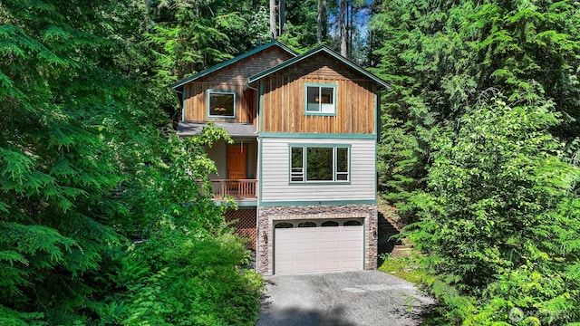 5 Arabian Way, Bellingham, WA 98229 - rustic home with driveway, stone siding, and an attached garage