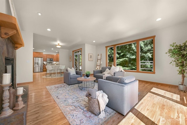 5 Arabian Way, Bellingham, WA 98229 - living area featuring light wood-style flooring, recessed lighting, and a fireplace with raised hearth