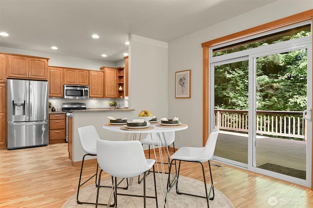 5 Arabian Way, Bellingham, WA 98229 - kitchen featuring appliances with stainless steel finishes, open shelves, light wood-style floors, recessed lighting, and brown cabinetry
