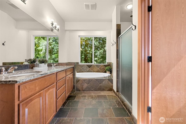 5 Arabian Way, Bellingham, WA 98229 - bathroom with stone tile floors, a garden tub, double vanity, and a stall shower