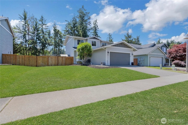 19826 207th Street Ct E, Orting, WA 98360 - view of front facade featuring board and batten siding, an attached garage, and driveway