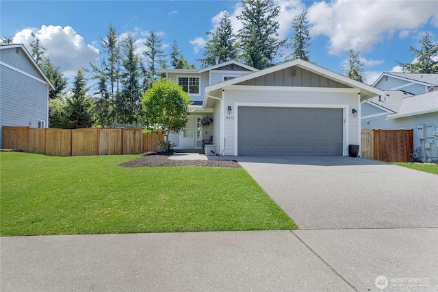 19826 207th Street Ct E, Orting, WA 98360 - view of front facade with a garage, board and batten siding, and concrete driveway
