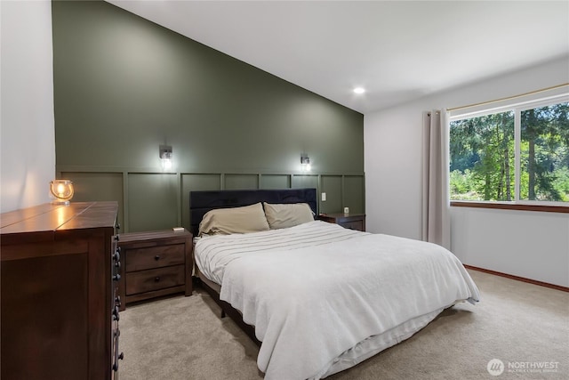 19826 207th Street Ct E, Orting, WA 98360 - bedroom with a decorative wall, lofted ceiling, and light carpet
