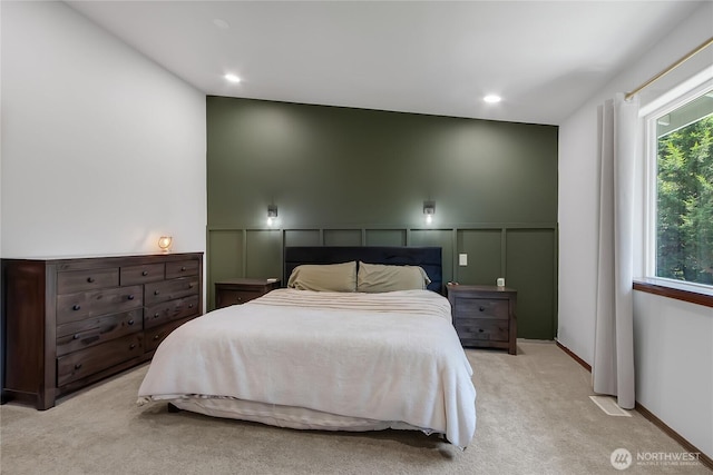 19826 207th Street Ct E, Orting, WA 98360 - carpeted bedroom with a decorative wall, wainscoting, and recessed lighting