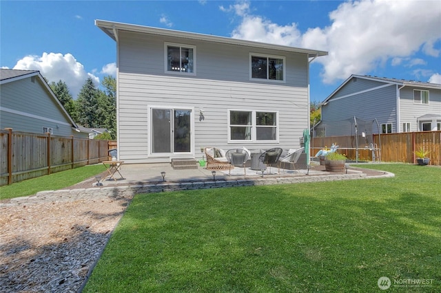 19826 207th Street Ct E, Orting, WA 98360 - back of house with a patio, a trampoline, and a fenced backyard