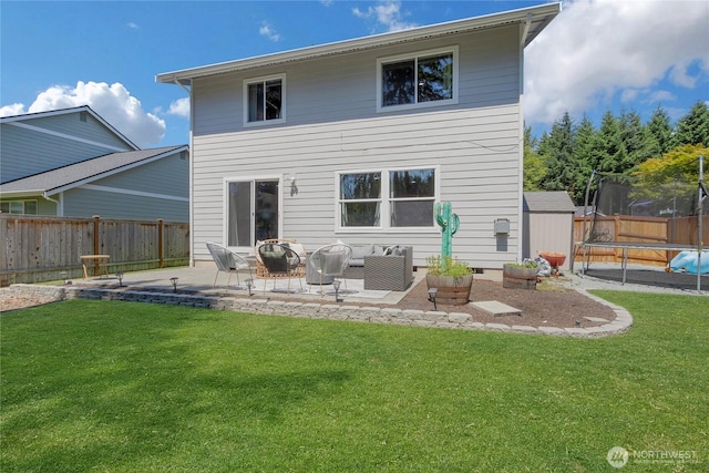 19826 207th Street Ct E, Orting, WA 98360 - back of house featuring a trampoline, a patio, a fenced backyard, and outdoor lounge area