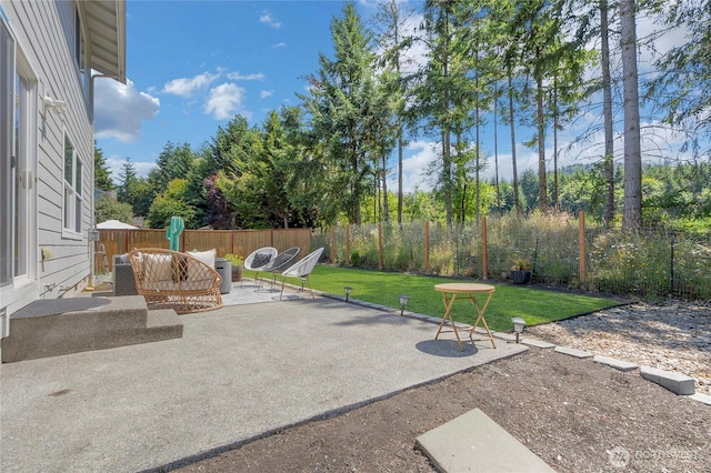 19826 207th Street Ct E, Orting, WA 98360 - fenced backyard with a patio