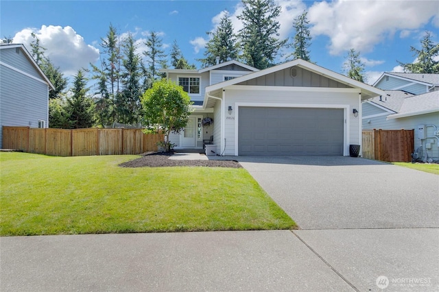 19826 207th Street Ct E, Orting, WA 98360 - view of front facade with a garage, board and batten siding, and concrete driveway