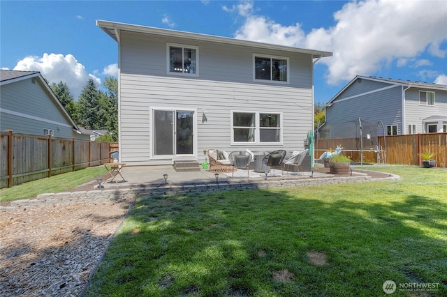 19826 207th Street Ct E, Orting, WA 98360 - rear view of property featuring a patio, a fenced backyard, and a trampoline