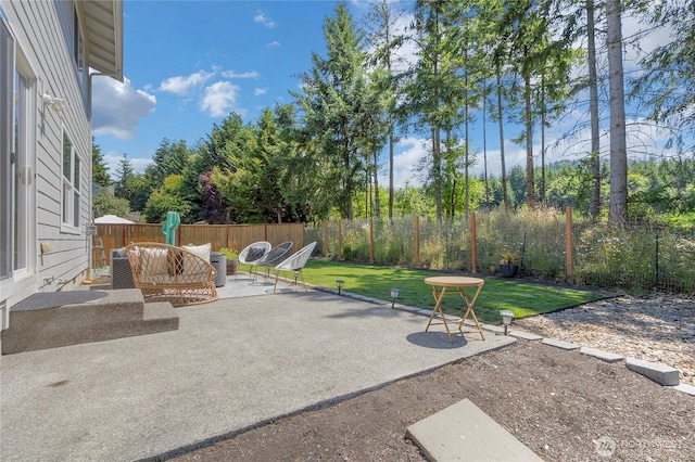 19826 207th Street Ct E, Orting, WA 98360 - fenced backyard featuring a patio area