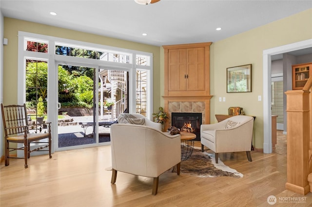 19808 Yew Way, Snohomish, WA 98296 - living area featuring light wood finished floors, a tile fireplace, and recessed lighting