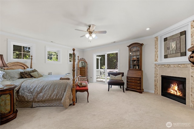 19808 Yew Way, Snohomish, WA 98296 - bedroom featuring access to outside, ornamental molding, a tiled fireplace, carpet flooring, and multiple windows