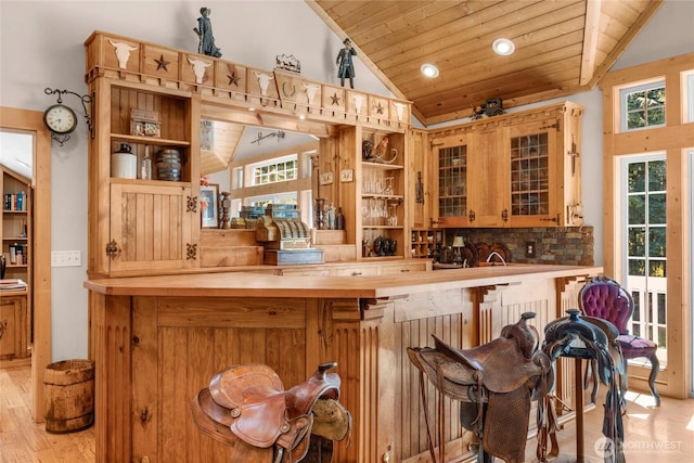 19808 Yew Way, Snohomish, WA 98296 - bar area featuring lofted ceiling, wooden ceiling, healthy amount of natural light, light wood-type flooring, and decorative backsplash