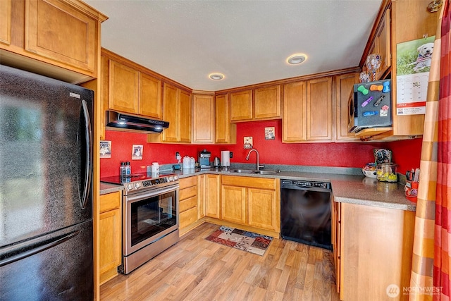 17141 SE 267th St, Covington, WA 98042 - kitchen with black appliances, under cabinet range hood, light wood-style flooring, brown cabinets, and recessed lighting
