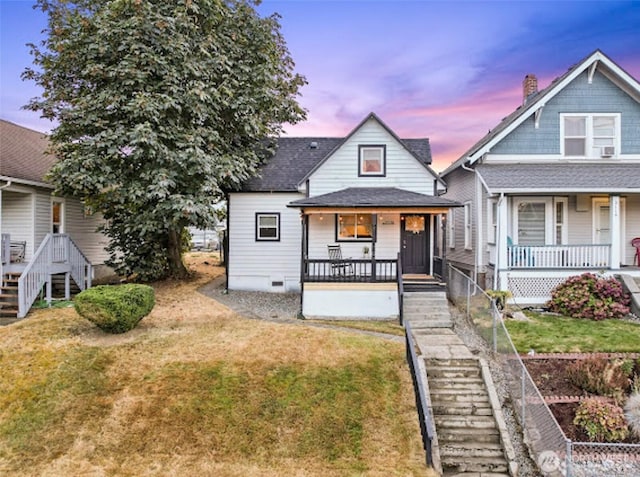 2118 S Sheridan Ave, Tacoma, WA 98405 - view of front of property with a porch, stairway, and a front lawn