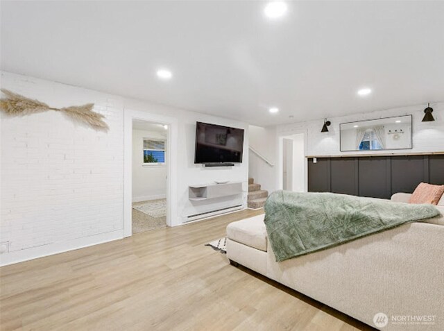 2118 S Sheridan Ave, Tacoma, WA 98405 - living area with stairway, light wood-style flooring, recessed lighting, and brick wall