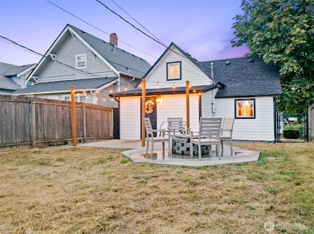 2118 S Sheridan Ave, Tacoma, WA 98405 - rear view of house featuring a fenced backyard, a patio area, and roof with shingles