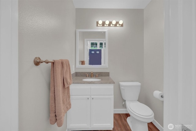 19168 110th Pl SE Unit 19168, Renton, WA 98055 - half bath featuring vanity and wood finished floors