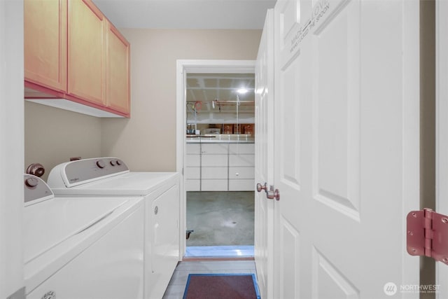 19168 110th Pl SE Unit 19168, Renton, WA 98055 - washroom with cabinet space, washing machine and dryer, and tile patterned floors