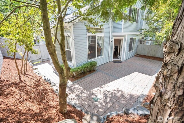19168 110th Pl SE Unit 19168, Renton, WA 98055 - rear view of house featuring a patio area and a fenced backyard