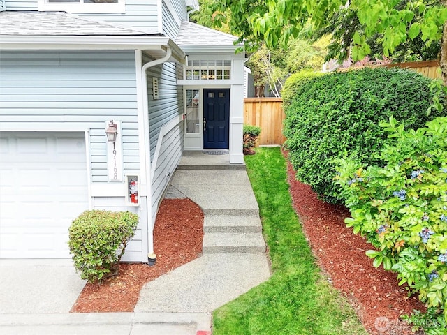 19168 110th Pl SE Unit 19168, Renton, WA 98055 - doorway to property with a shingled roof and a garage