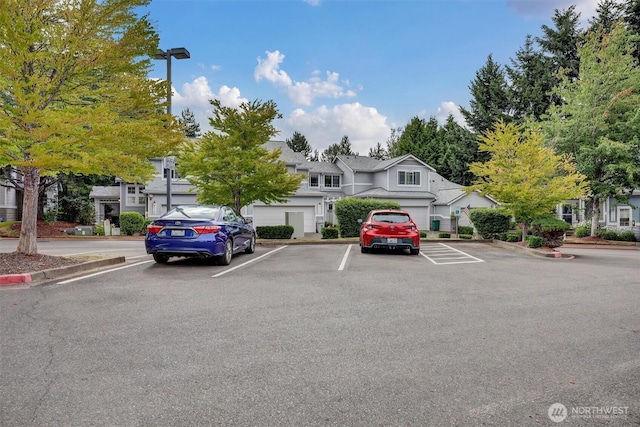 19168 110th Pl SE Unit 19168, Renton, WA 98055 - uncovered parking lot with a residential view