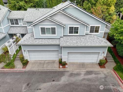19168 110th Pl SE Unit 19168, Renton, WA 98055 - traditional home featuring a garage, a shingled roof, and concrete driveway