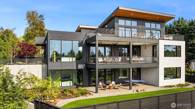 1032 89th Ave NE, Bellevue, WA 98004 - rear view of property featuring a balcony and a patio area