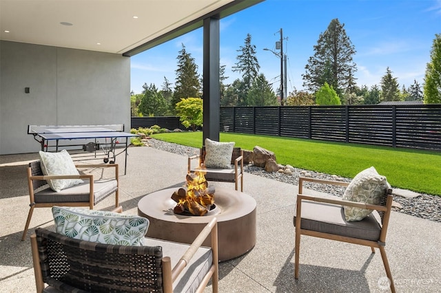 1032 89th Ave NE, Bellevue, WA 98004 - fenced backyard featuring an outdoor fire pit and a patio area