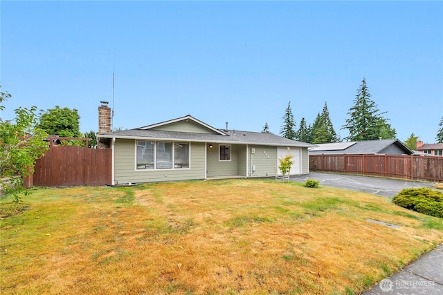 802 39th Pl, Bellingham, WA 98229 - view of front of house with asphalt driveway, a garage, and a chimney