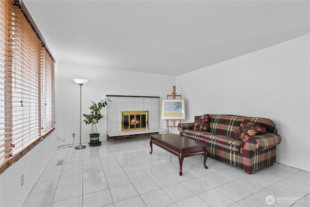 802 39th Pl, Bellingham, WA 98229 - living room with plenty of natural light, a tiled fireplace, and light tile patterned floors