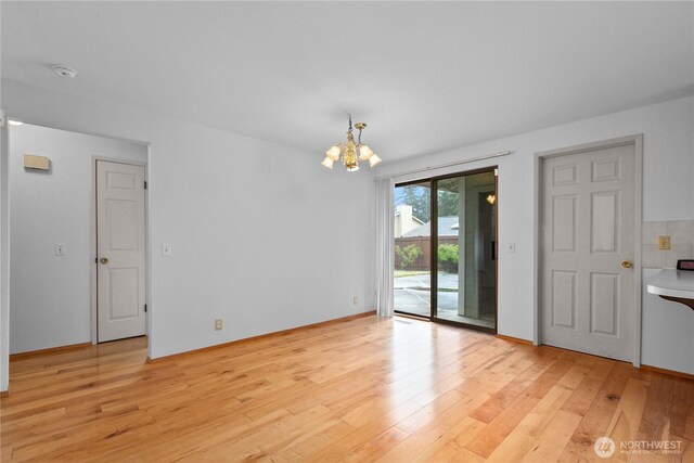 802 39th Pl, Bellingham, WA 98229 - spare room with a chandelier, light wood finished floors, and a smoke detector