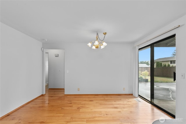 802 39th Pl, Bellingham, WA 98229 - spare room featuring a chandelier and light wood-style flooring
