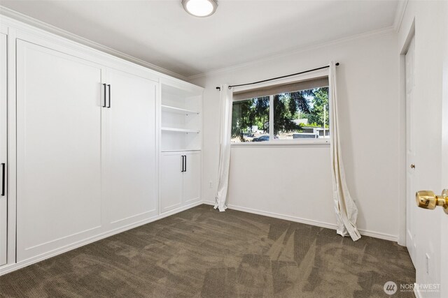 7519 Atchinson Dr SE, Olympia, WA 98513 - unfurnished bedroom featuring dark carpet and ornamental molding
