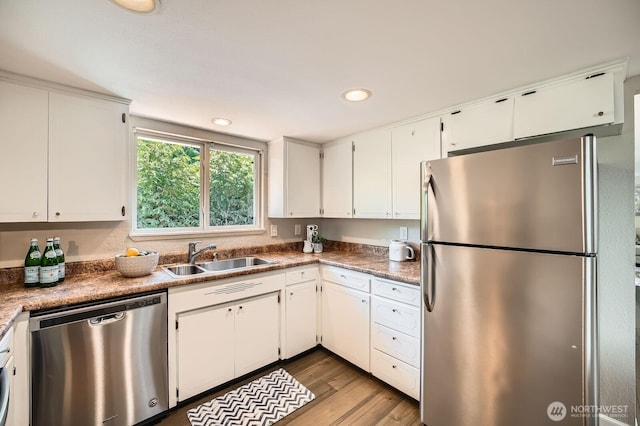 13601 SE 141st St, Renton, WA 98059 - kitchen featuring appliances with stainless steel finishes, white cabinets, wood finished floors, and recessed lighting