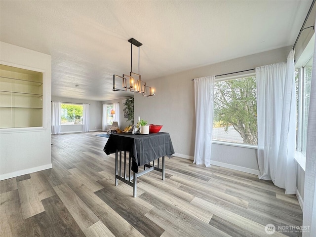 101 E Whidby Ave, Port Angeles, WA 98362 - dining space featuring light wood-style floors and a chandelier