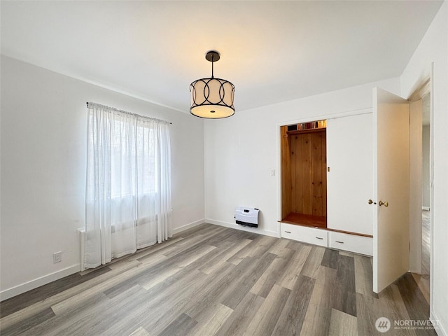 101 E Whidby Ave, Port Angeles, WA 98362 - empty room featuring wood finished floors and baseboards